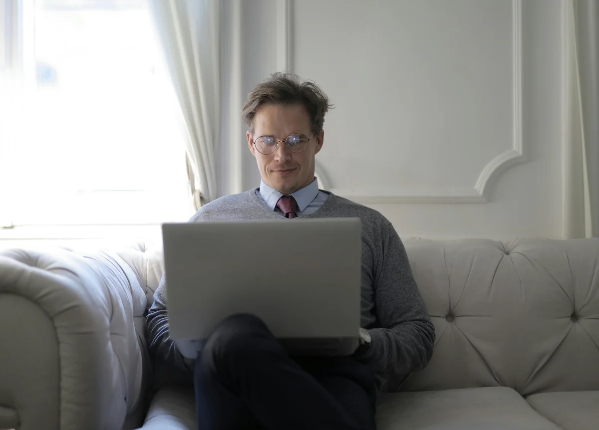 Person browsing IPTV VOD content on a dark interface