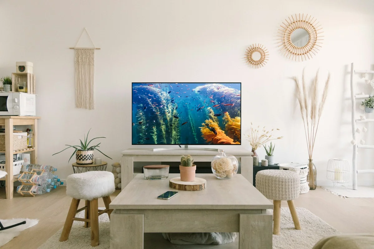 Modern smart TV displaying a streaming channel guide in a home living room — what is IPTV explained for beginners