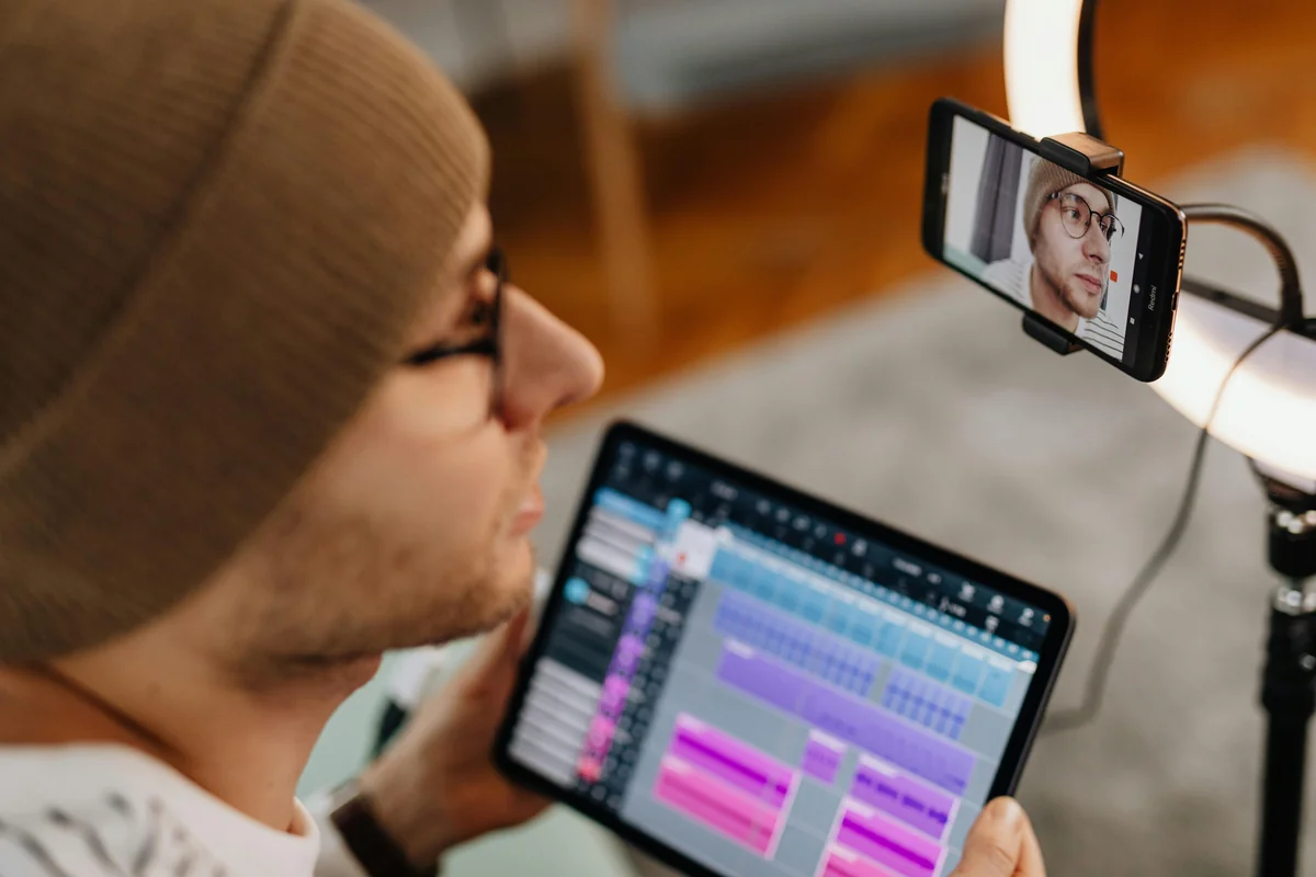 Person using a tablet with streaming content — a VPN can resolve ISP-level IPTV throttling