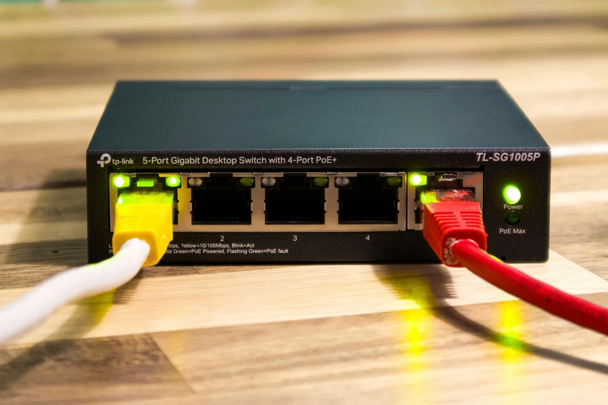 Broadband router and network cables — IPTV delivers TV content over the same internet connection you already use